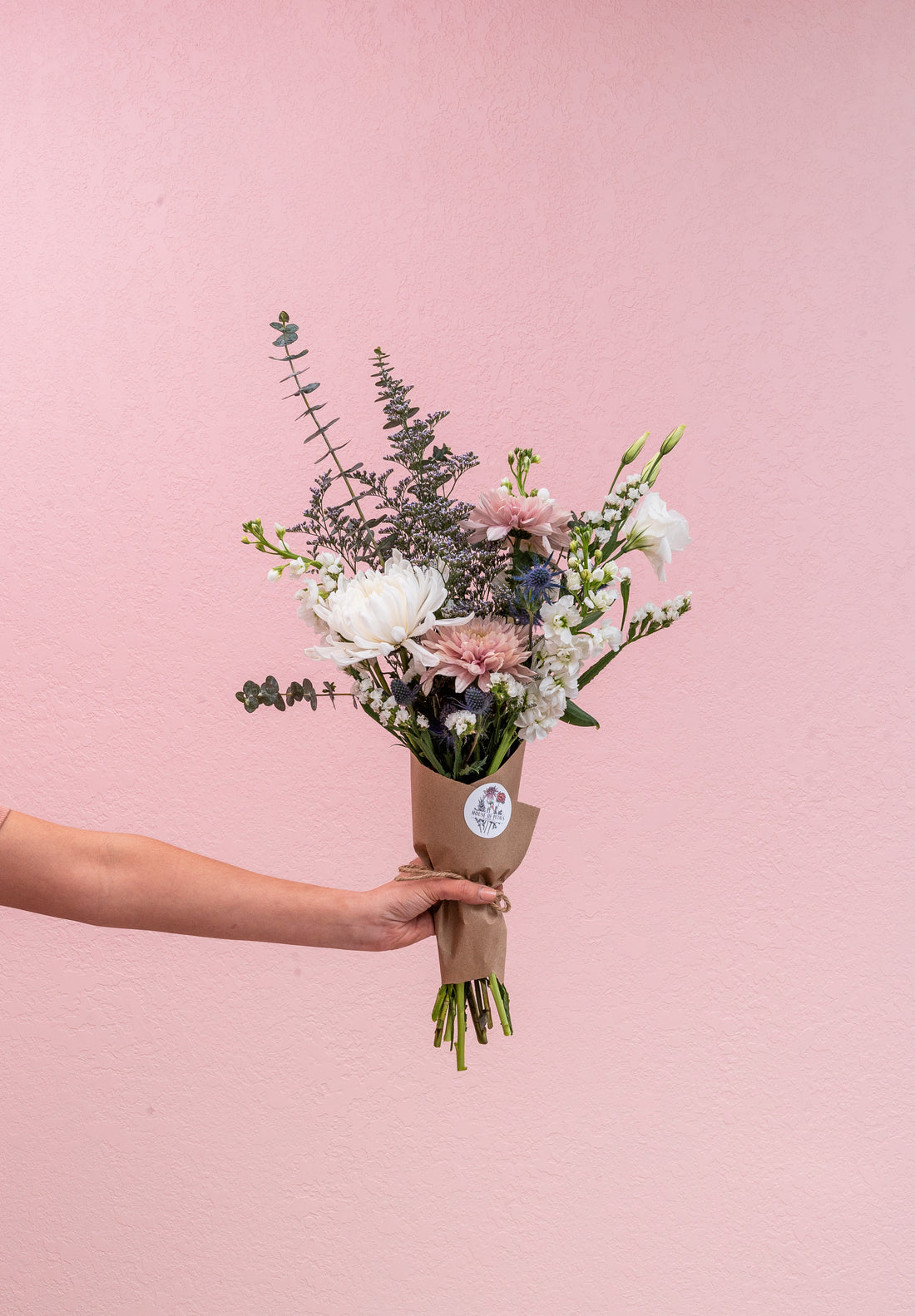 Our standard medium size arrangement includes 15-18 stems. Choose a wrapped option with our custom sticker or a vase.